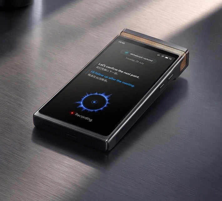 TransAI Note resting flat on a dark tabletop, with visible recording interface